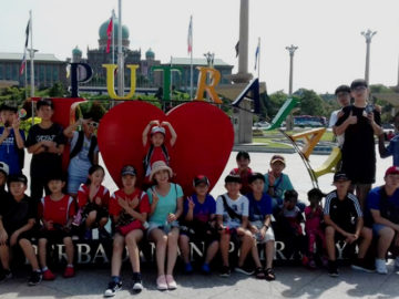 camp kids posing in front of I heart PutraJaya Sign