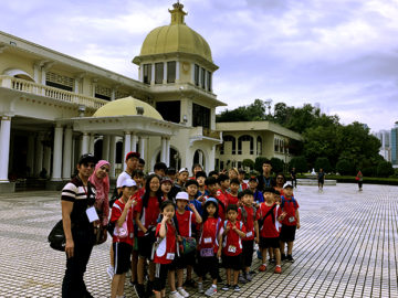 camp kids in front a british style building