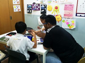 Students and a teacher working