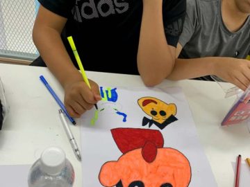 student working on comic book