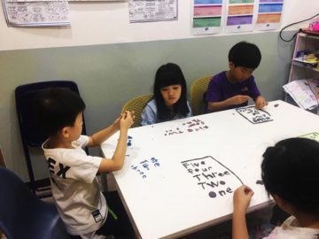 Students working on spelling numbers with play-dough