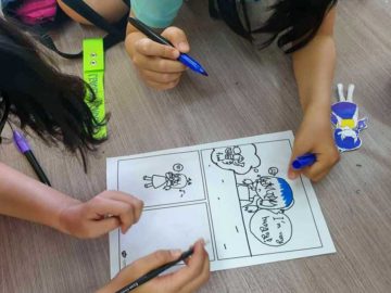 students group working on a comic