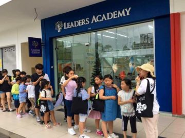 students lining up in front of Leaders Academy